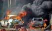 Smoke billows out of burning cars during 'Bharat Bandh'