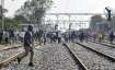Aspirants block railway tracks during their protest over