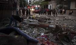 Palestinians search for survivors under the rubble of a