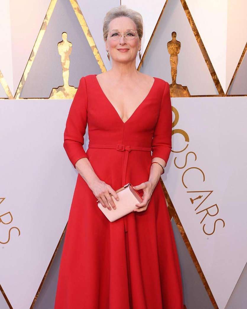While Twitter can’t stop comparing her scarlet red gown to Shrek’s fairy godmother’s gown, we’re totally in awe of The Post actress’ sartorial choices. 