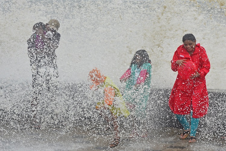 Mumbai: People enjoy a high tide at the Worli sea face in Mumbai on Saturday.